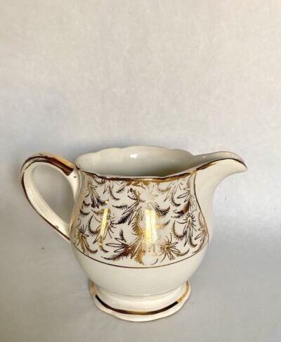 antique milk jug with gold design